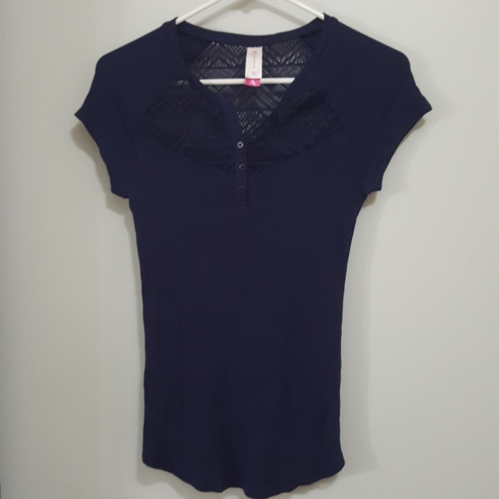 Adorable top with crochet detail.